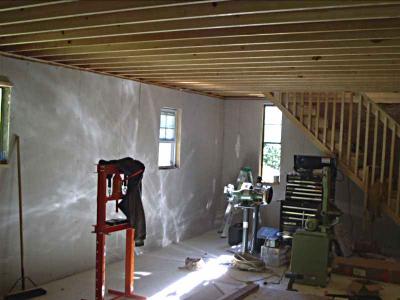 Ground floor after some work Ground floor, with flooring and some drywall