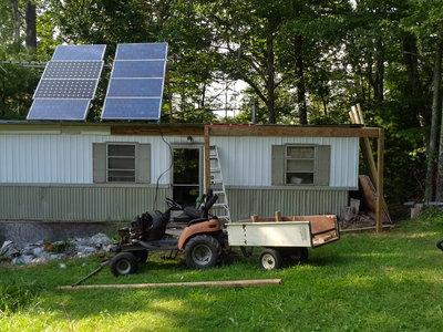 This will be 5.5 x 20 feet, and you can get out the door and into the wood and back under cover the entire trip.