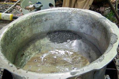 This stuff will happily sit under boiling water above its melting point and not melt for quite some time.  It makes water look like a lousy phase change heat storage media.