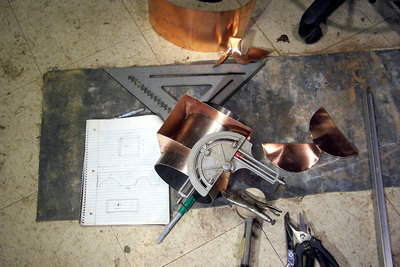 The sides for the new oven sitting on a piece of SS pipe that's just like the one in the fusor, ready for initial silver soldering.  I haven't put in the hole for the elbow for the copper pipe yet, it's pretty floppy now for that.