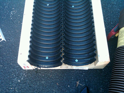 Lengthwise split corrugated pipe in place