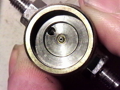The valve chamber, orifice is in the middle, the fittings are 10-32 threads.