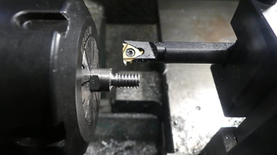 Joe Pie's threading backwards and outward method works really well and allows high rpm for good surface finish.